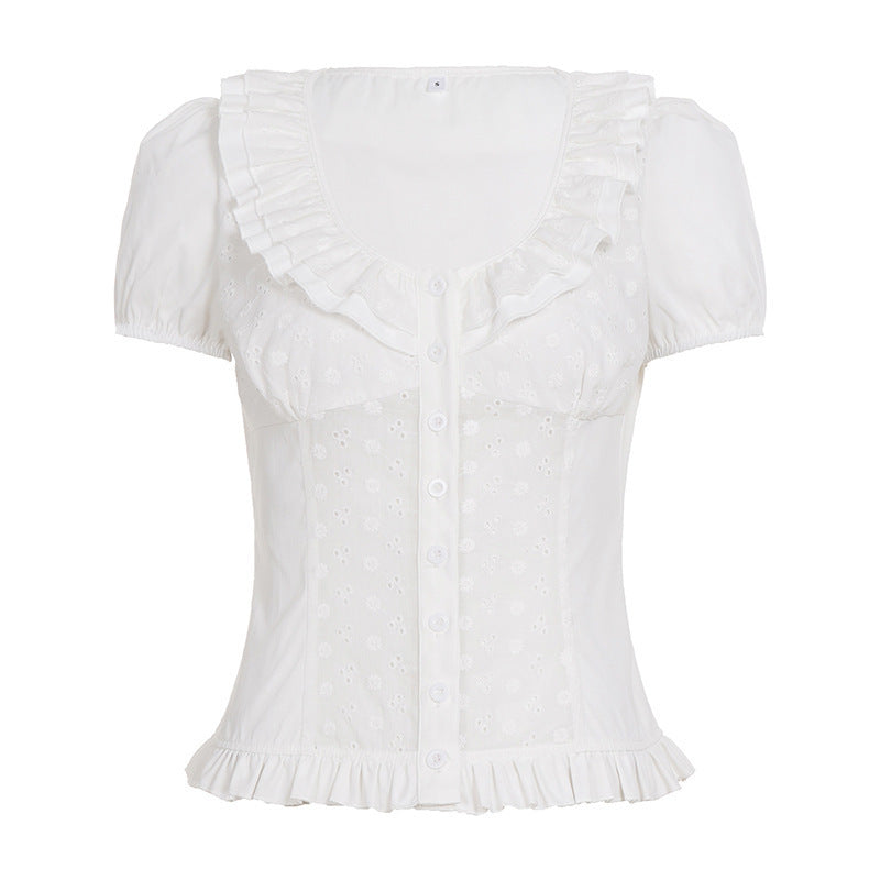 Dame volangskjorte med kortermede puffermer, blomsterprint og et stilrent design.