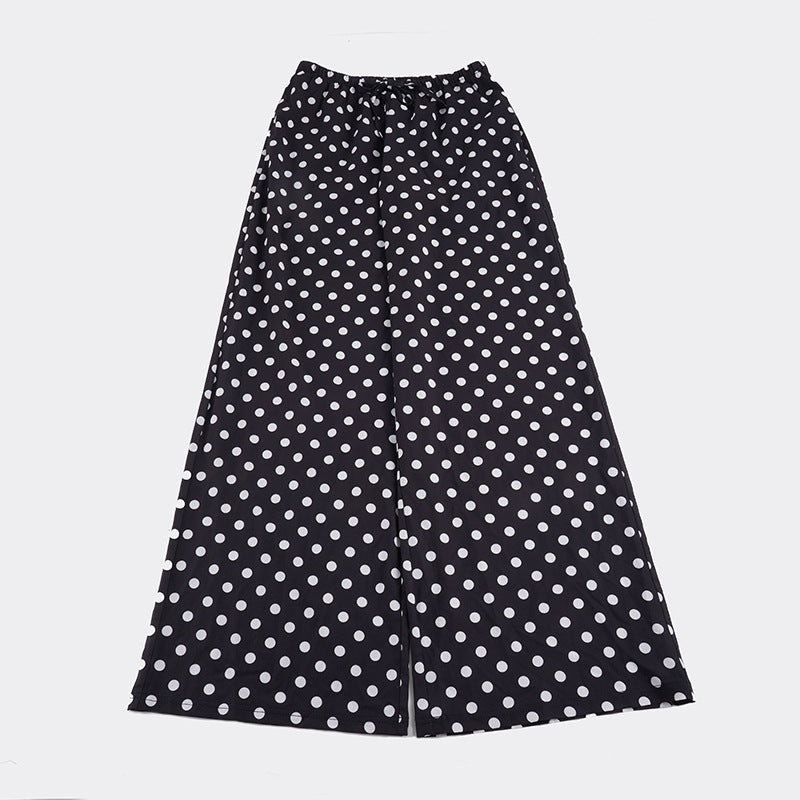 Damebukse med vide ben, elastisk midje og elegant polka prikk-design. En stilig og komfortabel hverdagsbukse.