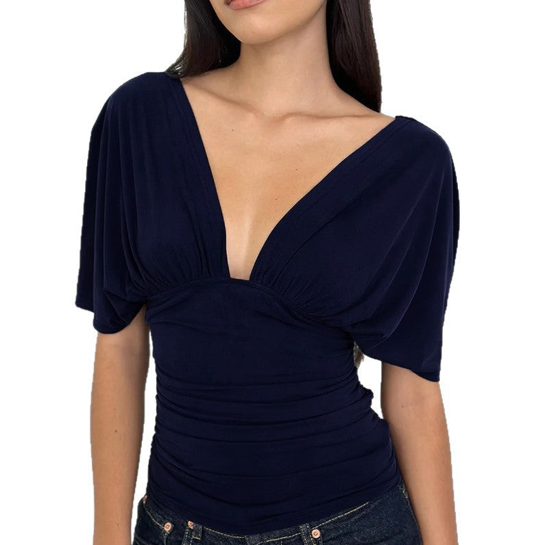 Klassisk dametopp med dyp V-hals, elegant drapering, langermet for en feminin stil.