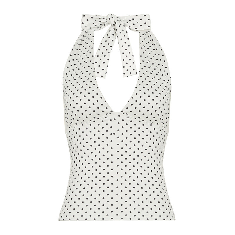Lekker dame halternecktopp med unikt prikkete design, fremhever en feminin og frisk stil.