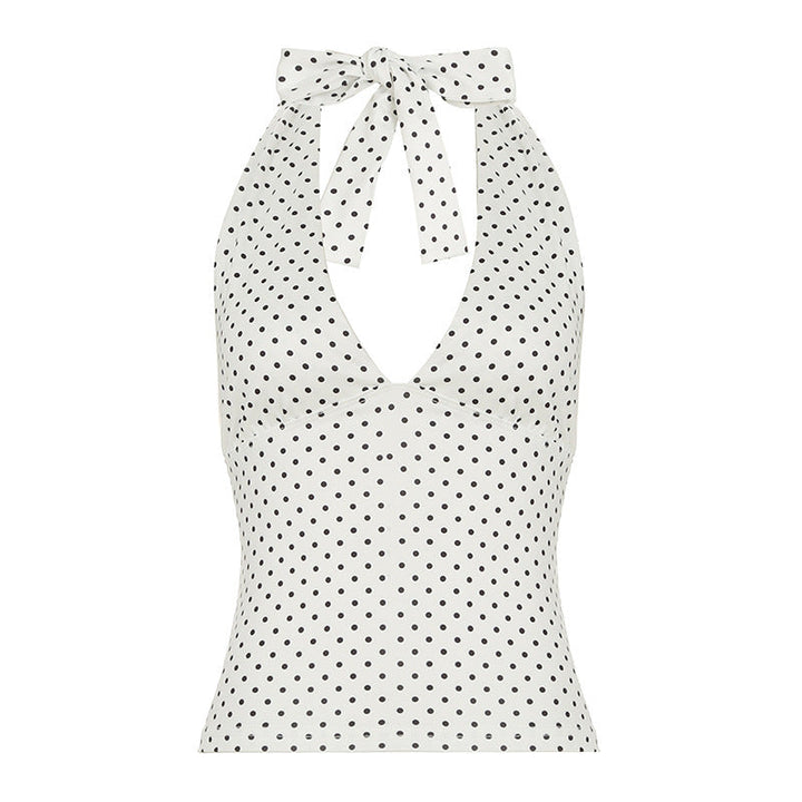 Lekker dame halternecktopp med unikt prikkete design, fremhever en feminin og frisk stil.