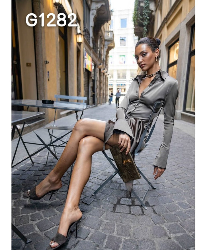 Festtopp for damer: Chic korsettbluse med transparente ermer.