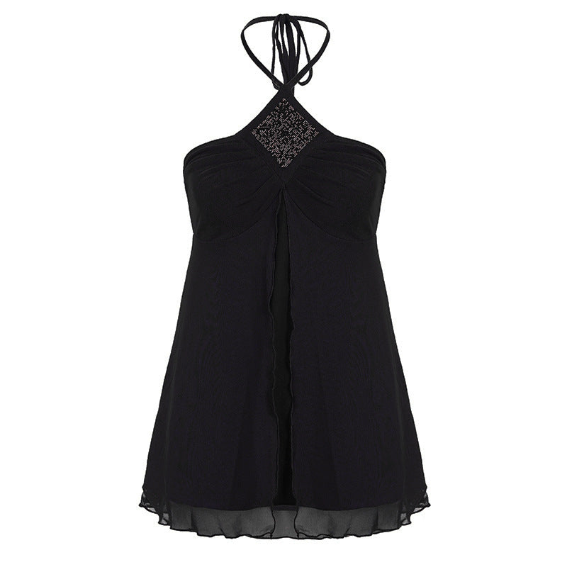 Allsidig dame halterneck topp, tilgjengelig i svart og lilla. Perfekt som elegant festtopp eller sommertopp.