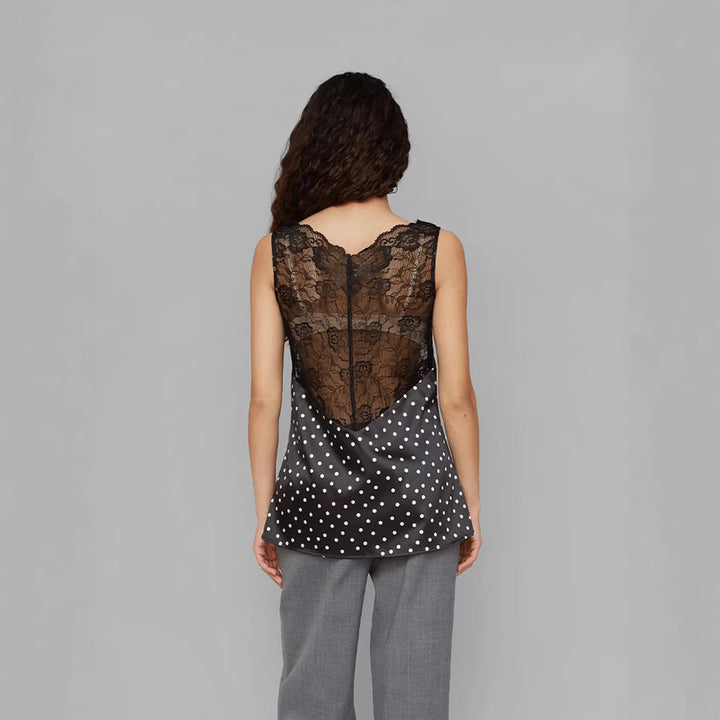 Kvinners elegante svarte sommer topp med polka dots, fine blondedetaljer og tynne spaghetti-stropper.