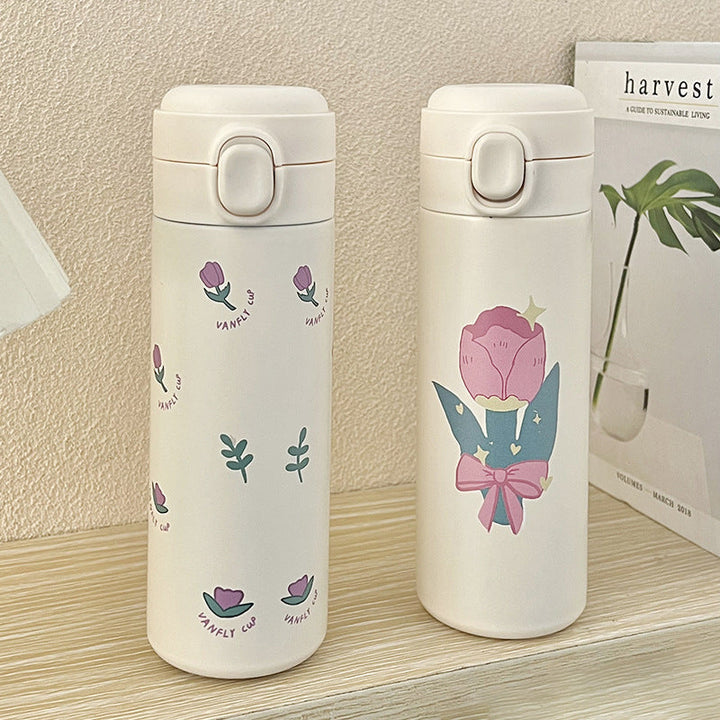 Grønn isolert drikkeflaske i rustfritt stål med blomsterdesign. Lekkasjesikker termos for dame.