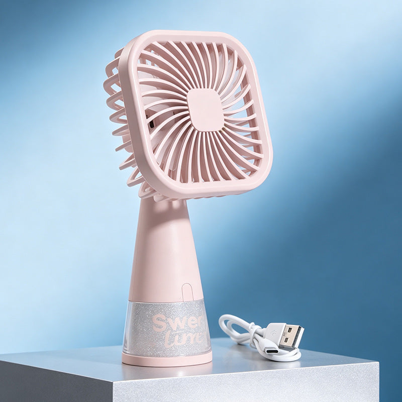 Grønn, bærbar minivifte med oppladbart batteri, for kjøling i enhver situasjon.