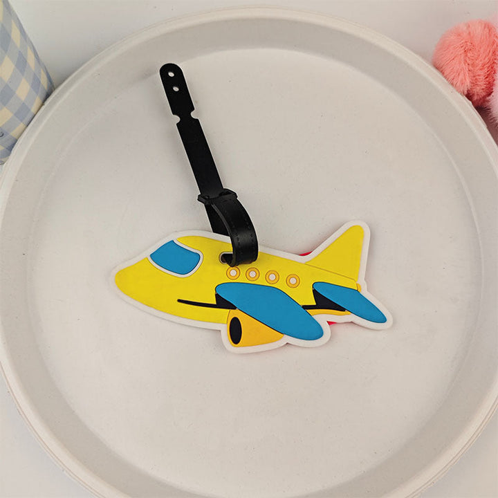 Praktisk bagasjelapp i stilig flydesign, et must for enhver reisende dame.