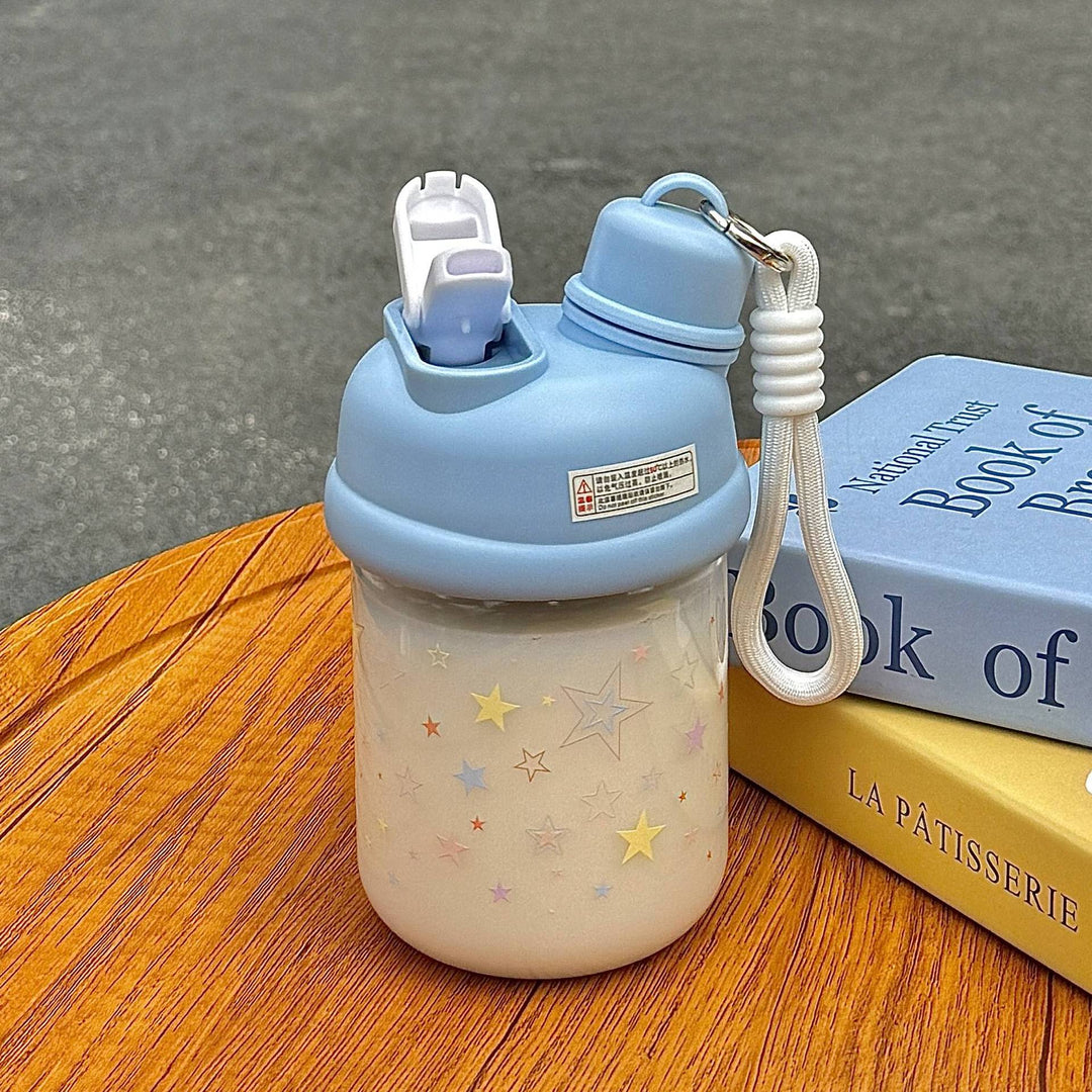 Blå isolert drikkeflaske for kvinner, 420ml, med lekkasjesikker dobbeltlokk og stjernemønster. BPA-fri termoflaske.