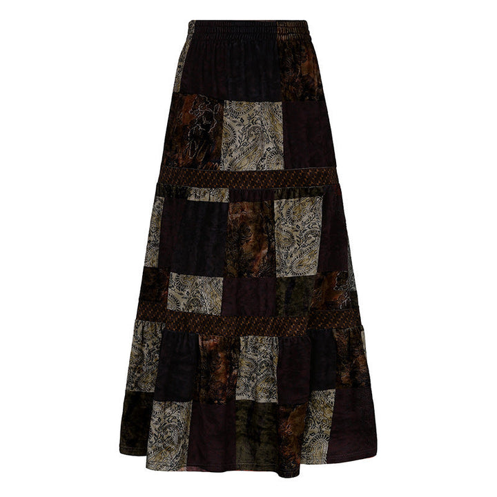 Stilrent langt dame maxiskjørt med blomstrete patchwork-mønster, perfekt for en komfortabel og elegant look.