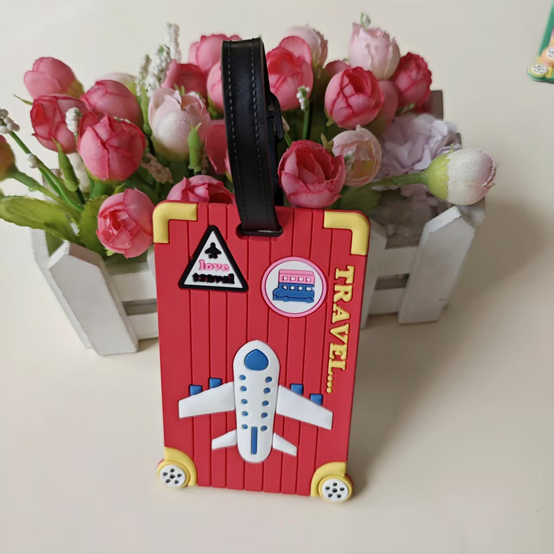 Reisetema silikon bagasjelapp med fly, sky eller kamera motiv. Unikt tilbehør til din koffert.