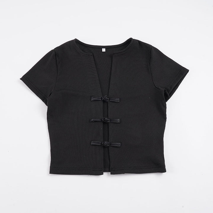 Allsidig dame overdel med unike knappdetaljer på brystet, ideell for en trendy look.