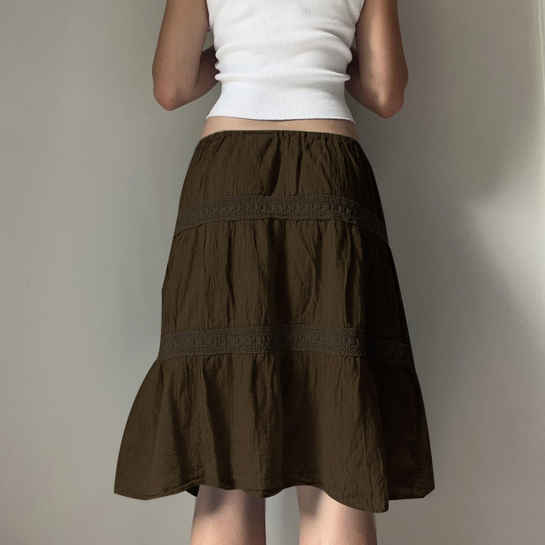 Allsidig brun jumpskirt til dame, med komfortabel elastisk midje og en stilren, luftig design.