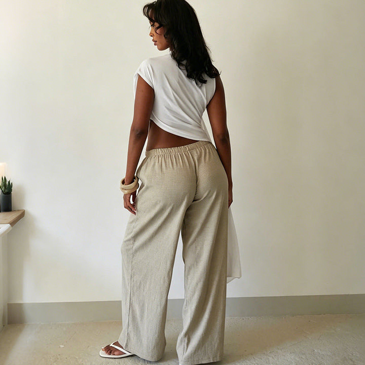 Elegant festtopp for dame, asymmetrisk med draperinger for et moderne og sofistikert uttrykk.