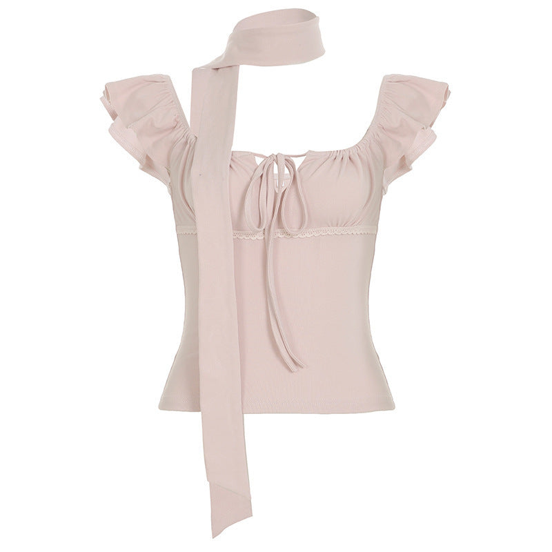 Elegant topp for damer: rosa slangemønster og volanger som fremhever et moteriktig utseende.