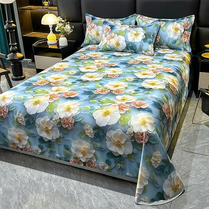 Komfortabelt sengeteppe med detaljert blomsterdesign, ideelt for et koselig soverom og elegant interiør.