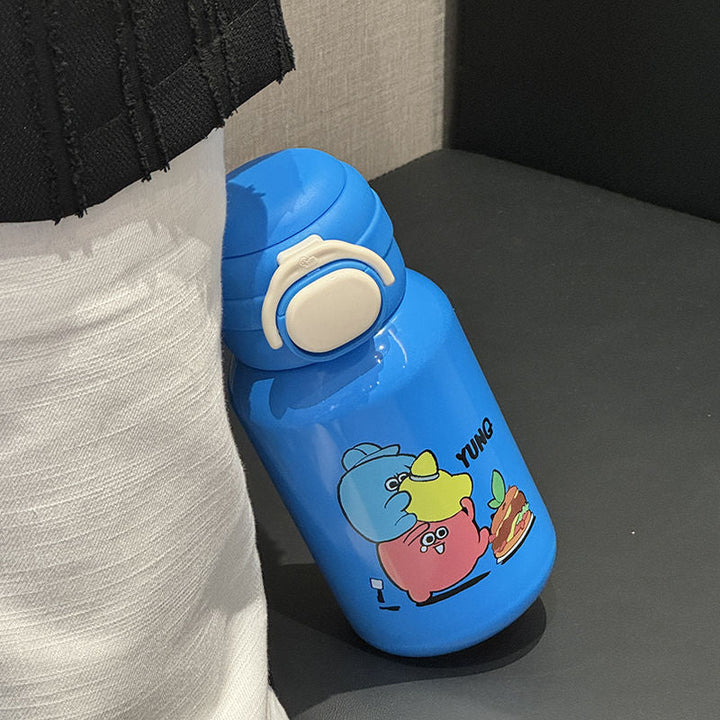 Dame vannflaske i rustfritt stål med morsomt tegneseriedesign. Bruk til jobb, trening og skole.