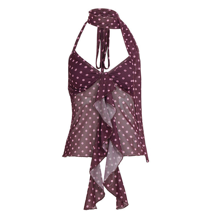 Leken lilla sommertopp med halterneck, søte prikker og volanger. Flott for casual strandmote og hygge.