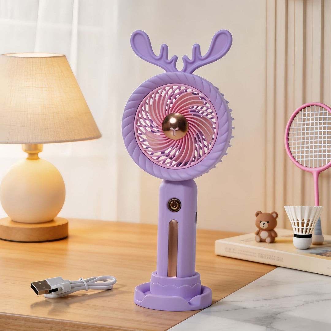 Håndholdt minivifte for damer med sjarmerende gevirdesign. Enkel å lade via USB.