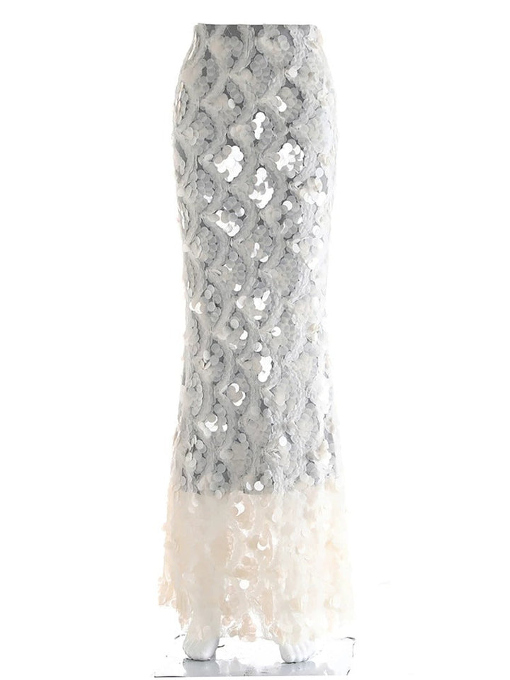 Dame volang maxiskjørt i hvitt med transparent design, perfekt for et elegant sommer- eller kveldslook.