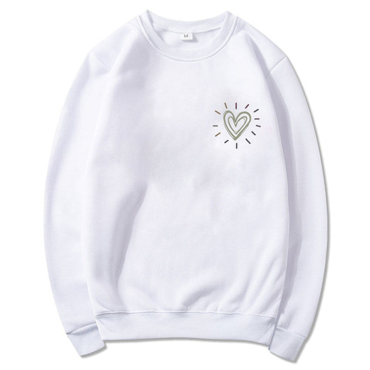 Feminin oversized sweatshirt med sjarmerende hjerter. Avslappet snitt for stil og komfort.