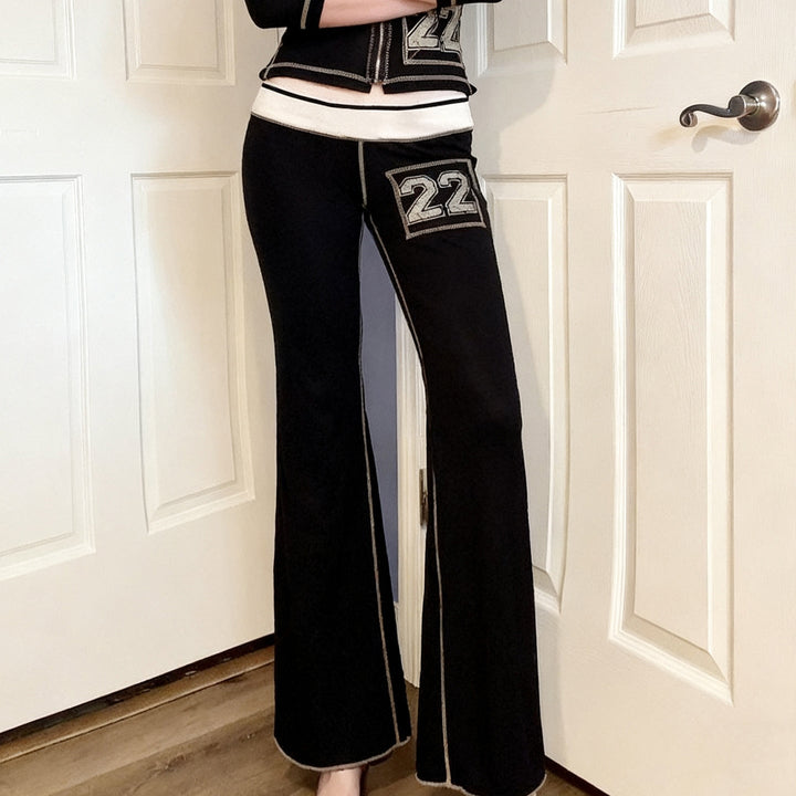 Komfortable svarte bootcut-bukser for damer, med elastisk midje. Ideelle for fritid og casual mote.