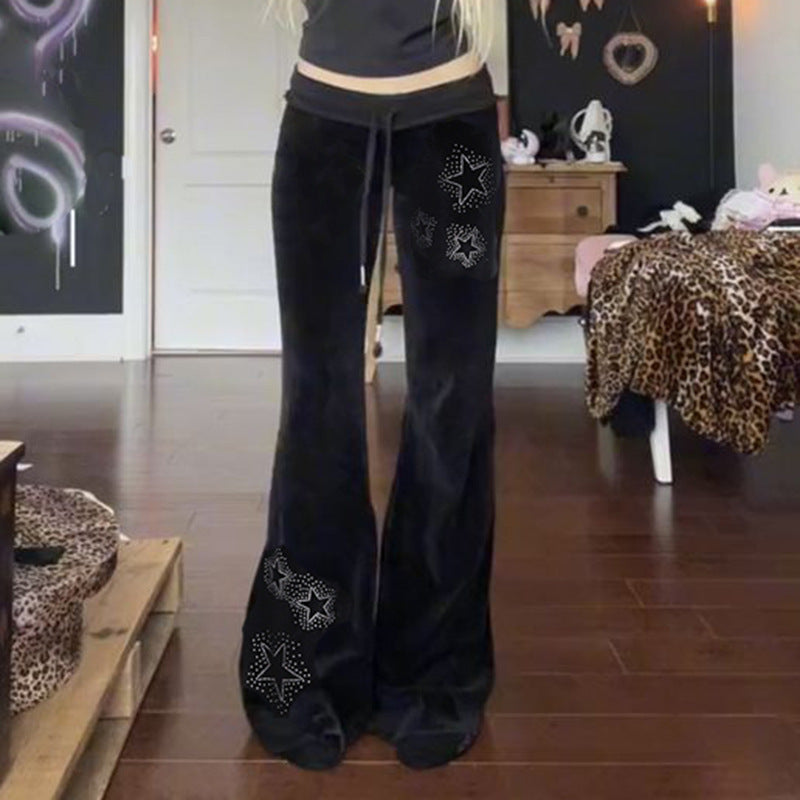 Dame flare joggebukser med glitrende stjerner. Komfortable og stilfulle bukser, perfekt for fritid og mote.