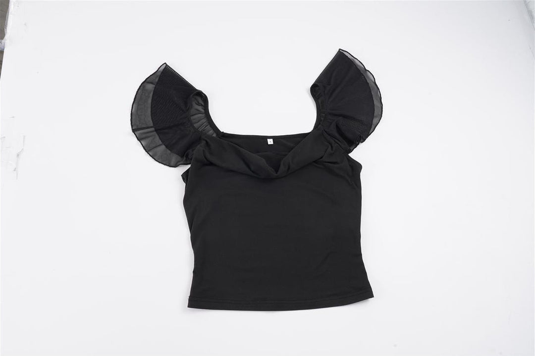 Stilfull kortermet topp for dame med transparente puffermer, egnet for både fest og hverdagsbruk.