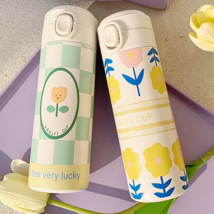 Stilig isolert drikkeflaske for dame, 500ml. Vakker solgulf termoflaske med blomstermotiv og trygt lokk.