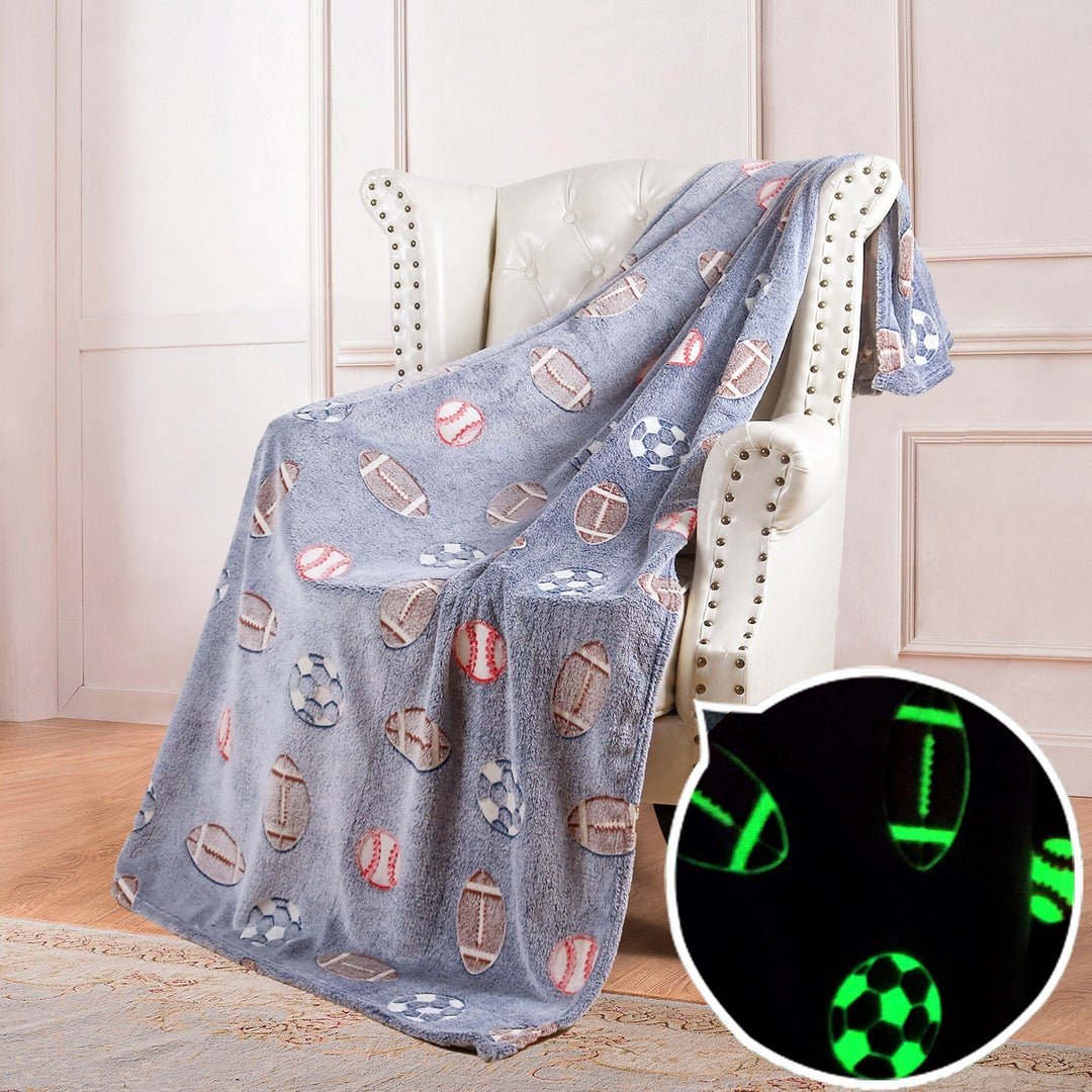 Unikt unisex pledd i sporty design med glød-i-mørket funksjon for varme og moro.