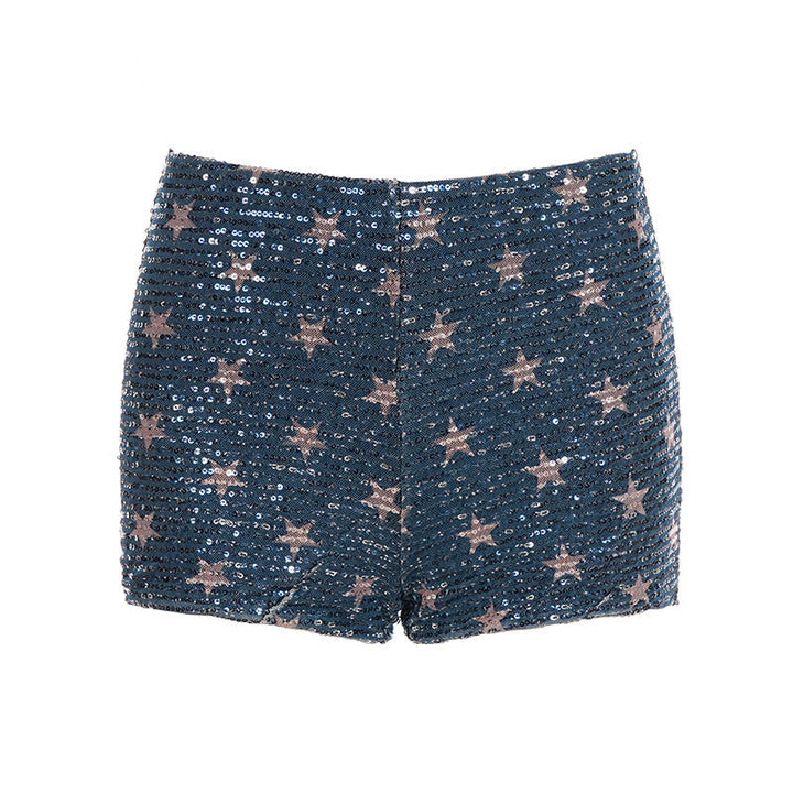 Trendy blå dameshorts med glitrende stjerner og paljetter, designet for en elegant og festlig sommermote.