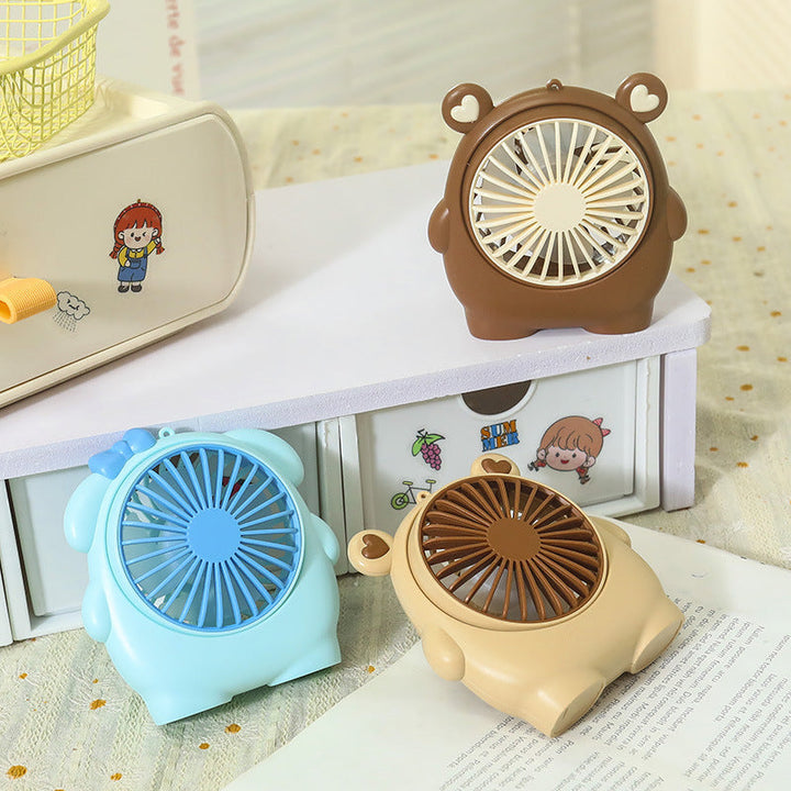 Håndholdt mini-vifte med lekent kanin-dyredesign. En kjølig sommer gadget, perfekt reiseutstyr.