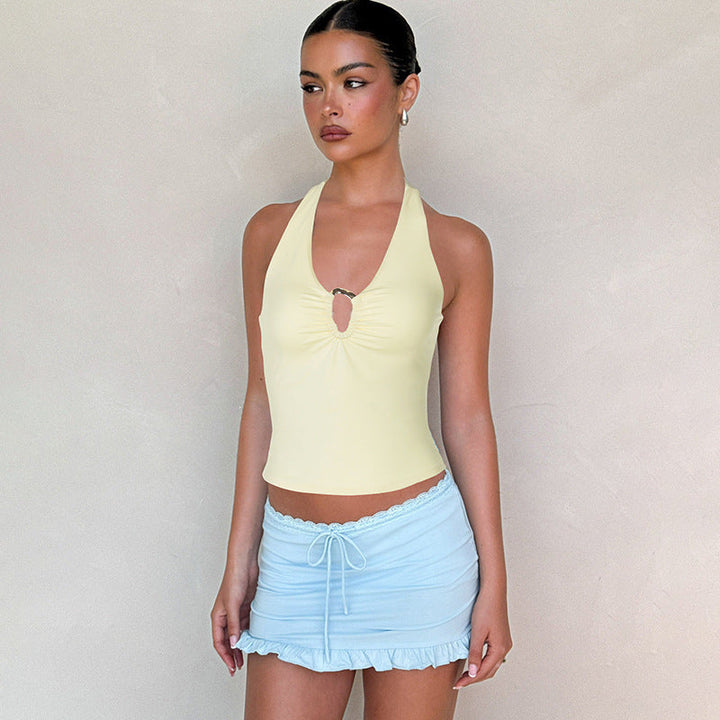 Moderne dame halterneck topp med splitt, et chic og casual valg for sommergarderoben.