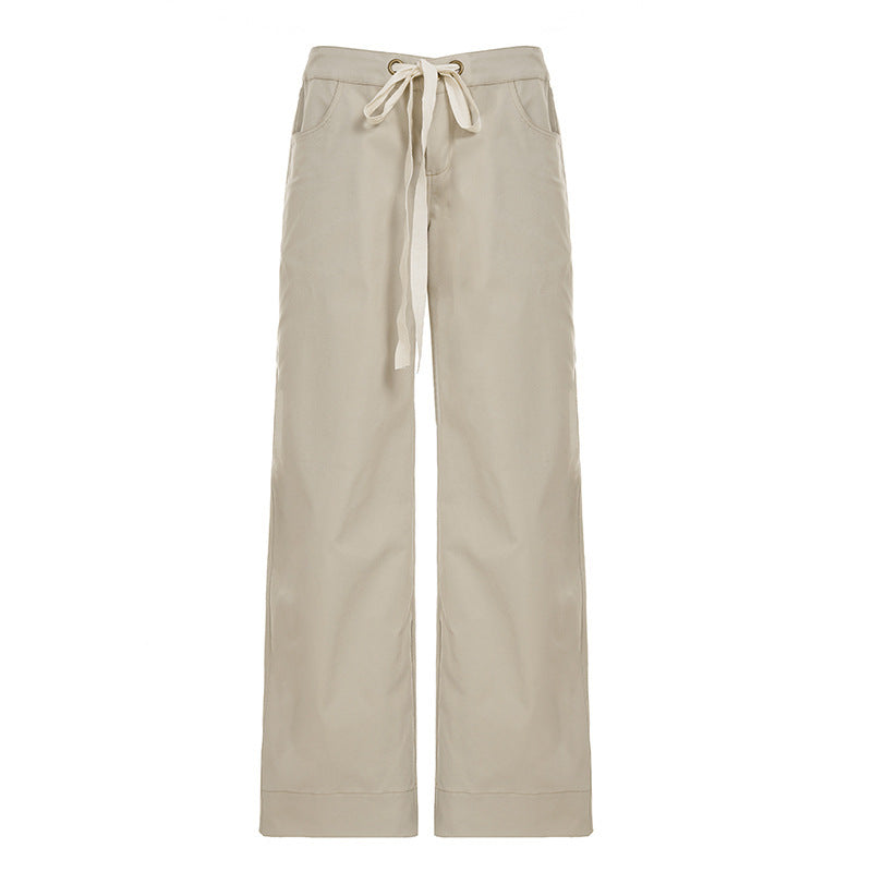 Stilige vide damebukser i khaki med justerbar midje, perfekte for varme dager.