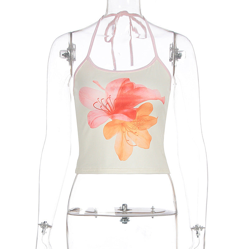Vibrant blomsterprint dame crop-top med halterneck. Fargerik og moteriktig for varme sommerdager.