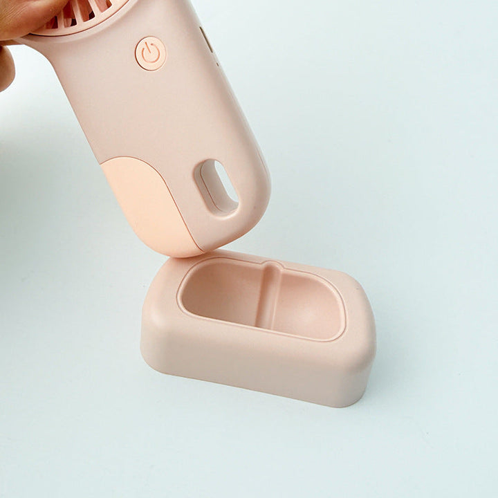 Rosa bærbar minivifte med stativ. Kompakt USB vifte for personlig avkjøling på farten. Sommerklar gadget.