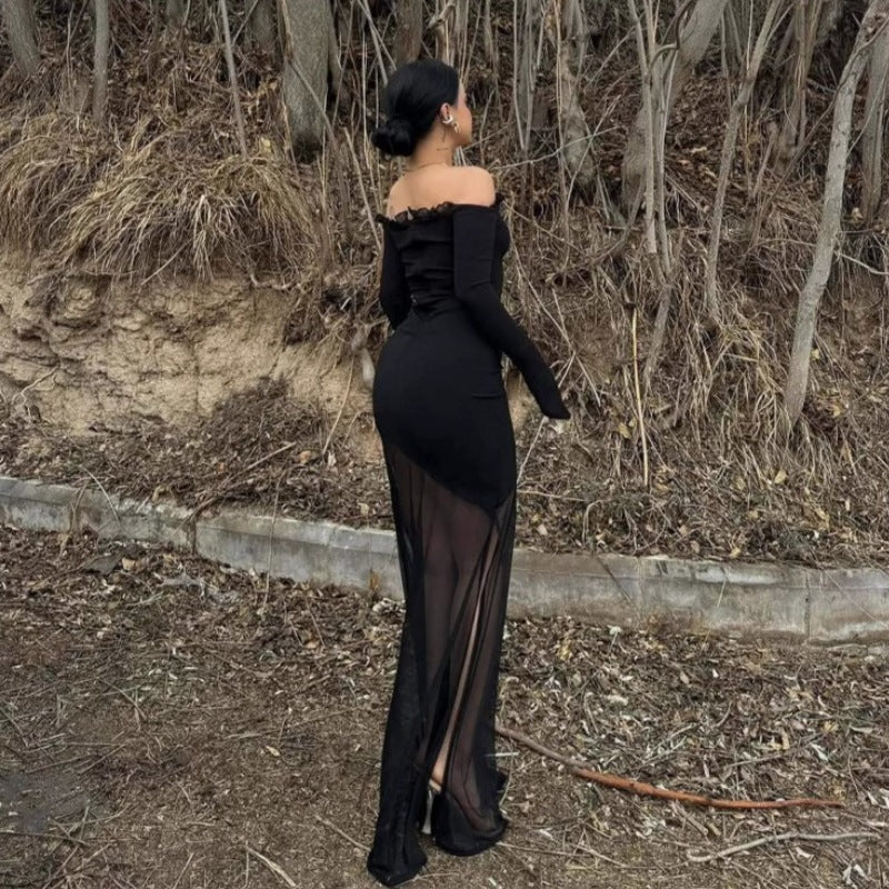 Lang damekjole, svart off-shoulder design, gjennomsiktig skjørt for en elegant festlook.