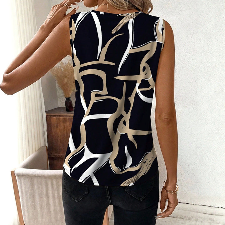 Elegant svart v-hals topp for dame med stilrent grafisk mønster. Komfortabel og casual passform.