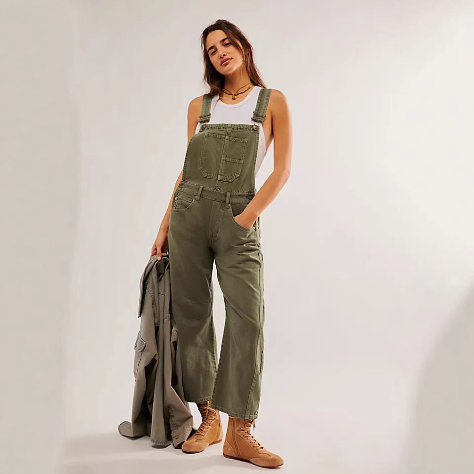 Moderne offwhite denim jumpsuit med brede, justerbare stropper for en elegant og avslappet look.
