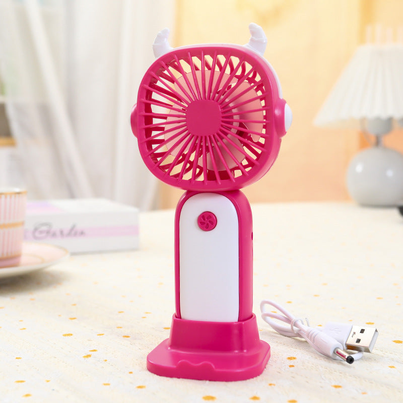 Ergonomisk USB-minivifte i gul og magenta, ideell for skrivebordet eller hjemmekontoret. Stille og bærbar kjøling.
