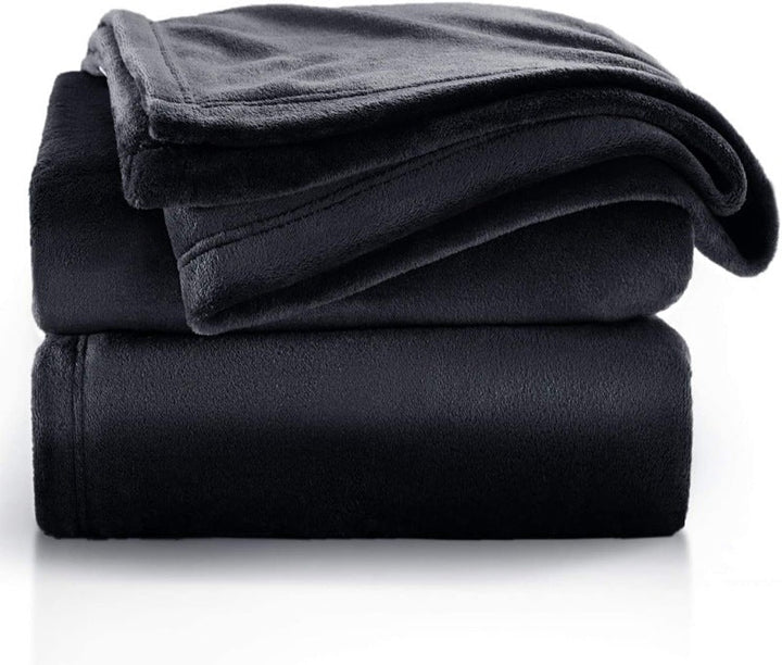 Allsidig vendbart plysjteppe som passer perfekt som sofateppe, slumreteppe eller varmt fleeceteppe for hygge.