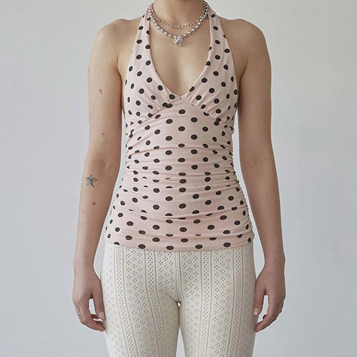 Elegant dame spaghetti topp med prikket mønster, volanger og praktiske justerbare stropper for sommerklær.