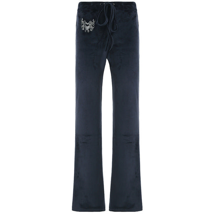 Nærbilde av det myke og pustende stoffet i grå dame flared sweatpants, for optimal komfort.
