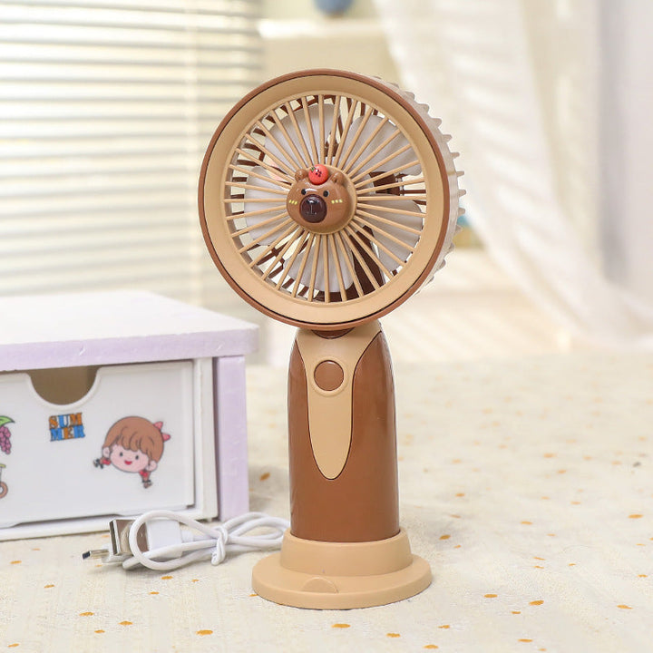 Komfortabel bærbar håndvifte for kvinner, med søt dyredesign som gir lett og effektiv sommer-kjøling.