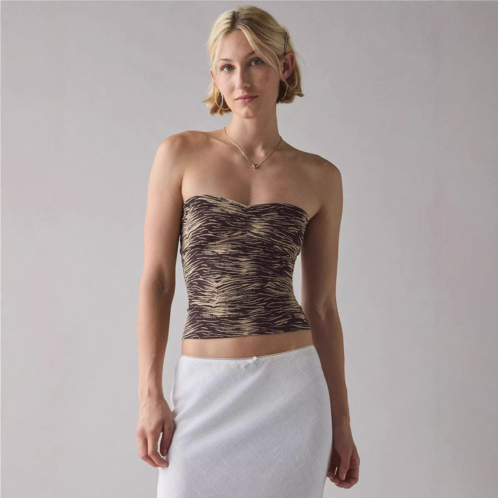 Elegant dame bandeau-topp med stilige striper, perfekt for sommermote og fritidsklær. Komfortabel og trendy.