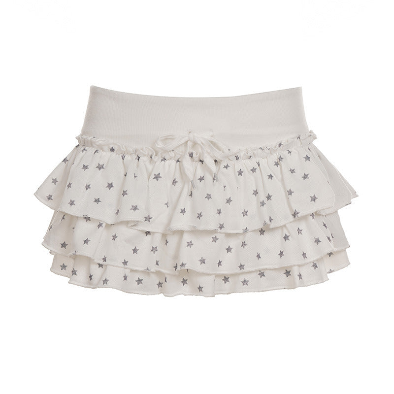 Dame sommerskjørt med stjernemønster og volanger. Elastisk midje for komfort og stil. Trendy og allsidig.