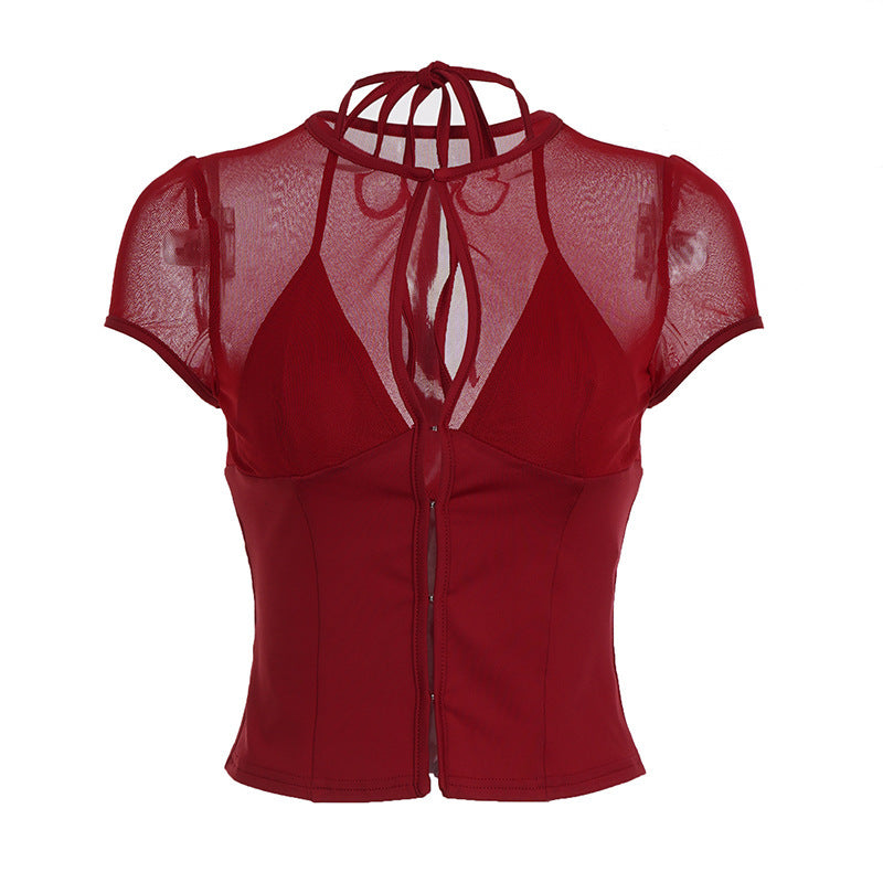 Stilfull festtopp for dame i transparent mesh. Moderne design med dekorativt knytebånd.