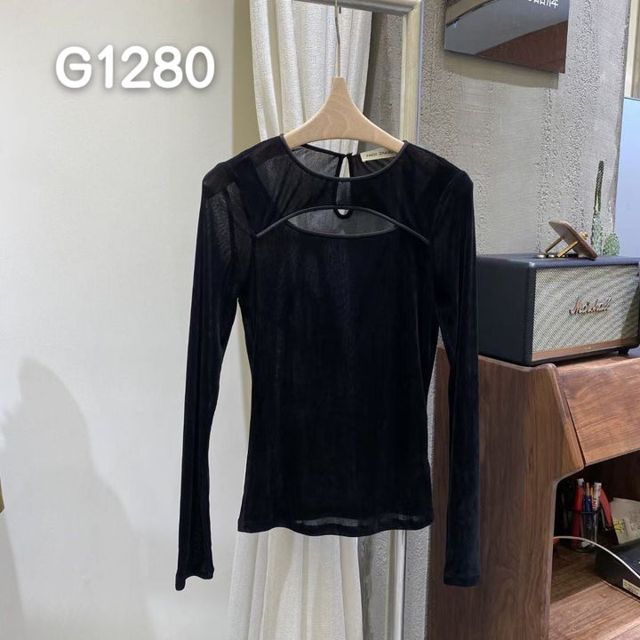 Svart korsettbluse med gjennomsiktige ermer, en elegant damebluse.