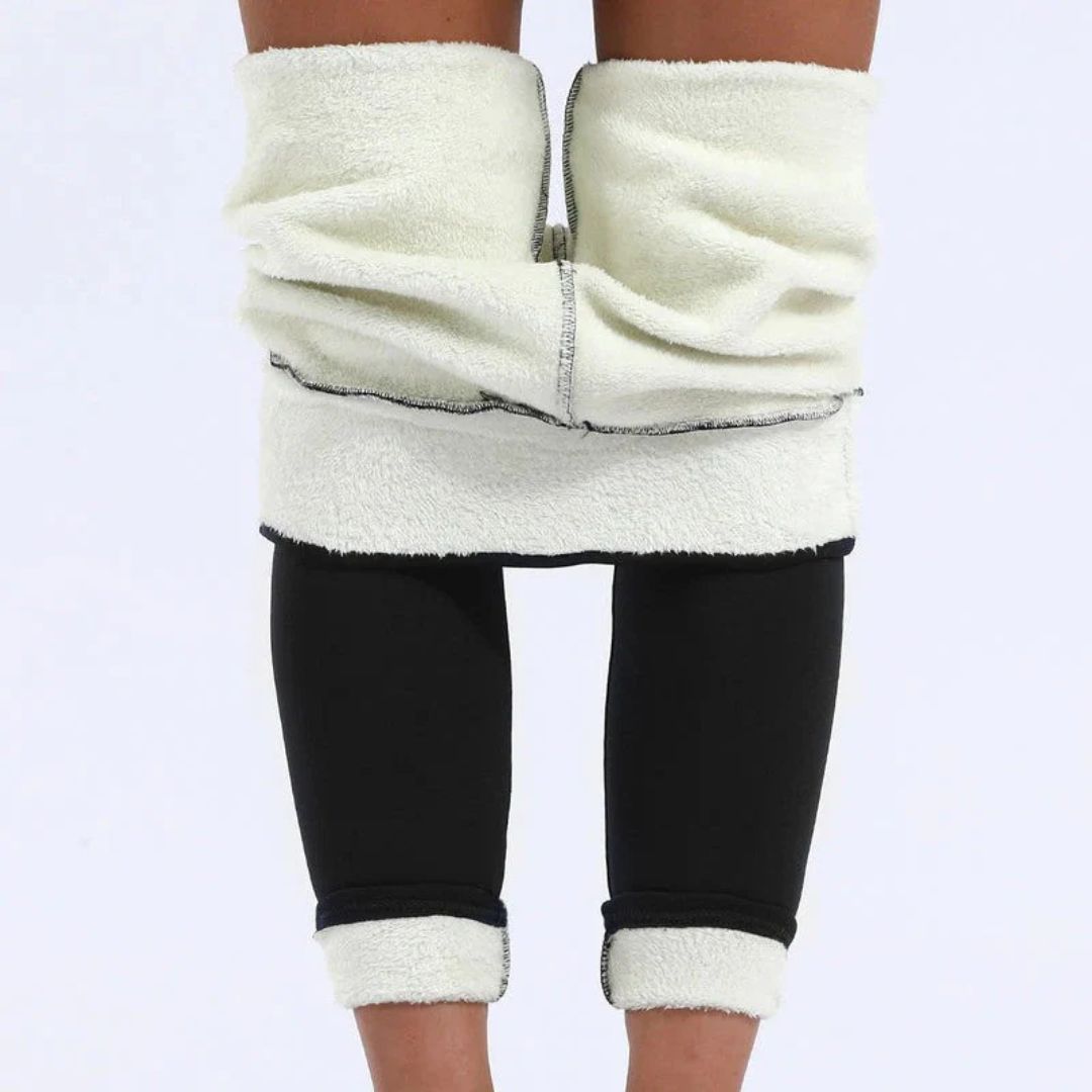 Bakfra-bilde av kvinne i høy midje vinterleggings, viser flatterende passform og komfortabel design.