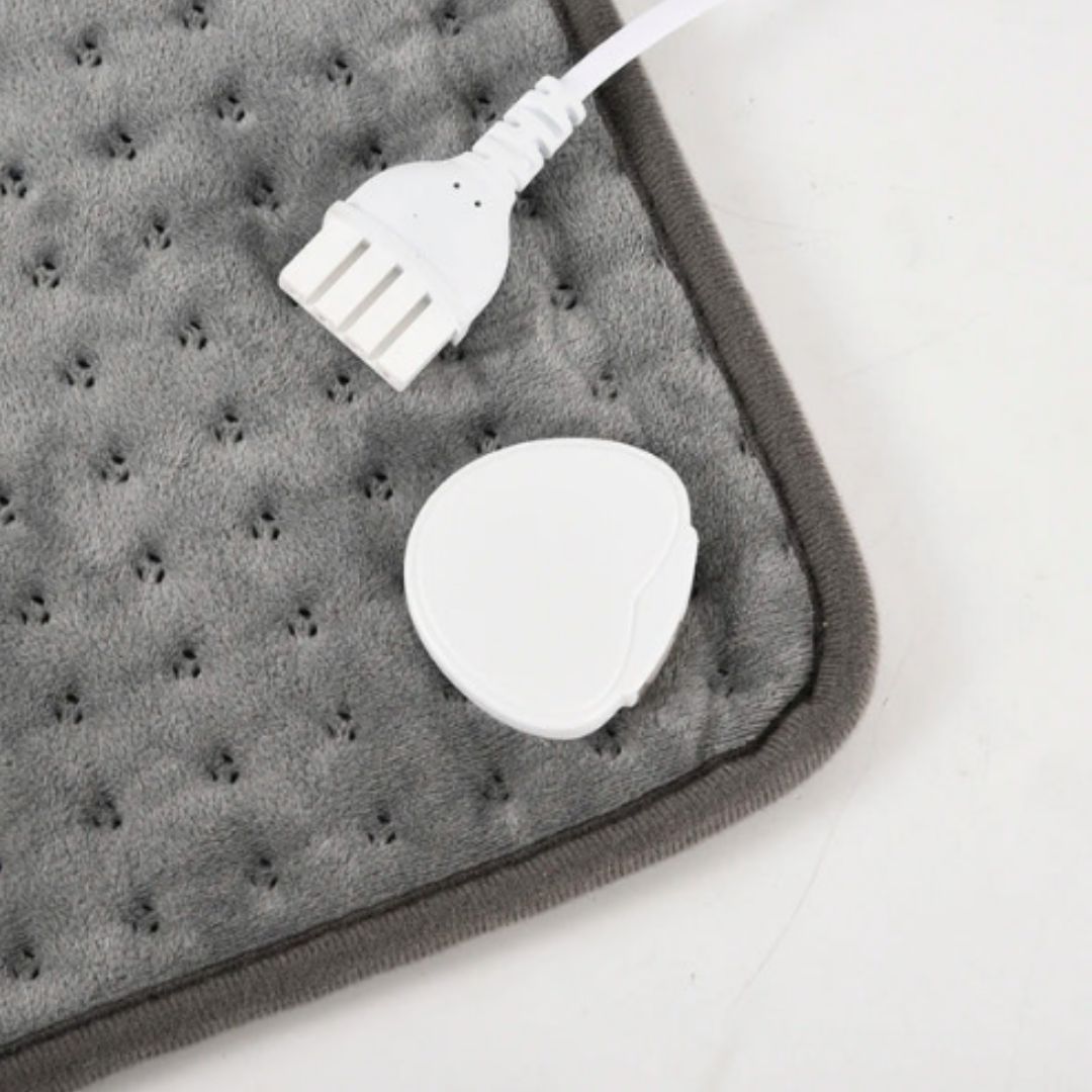 Myk elektrisk varmedyne for rygg og overkropp, perfekt for avslapning og varme hjemme eller på kontoret.