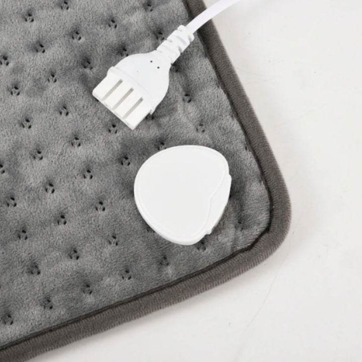 Myk elektrisk varmedyne for rygg og overkropp, perfekt for avslapning og varme hjemme eller på kontoret.